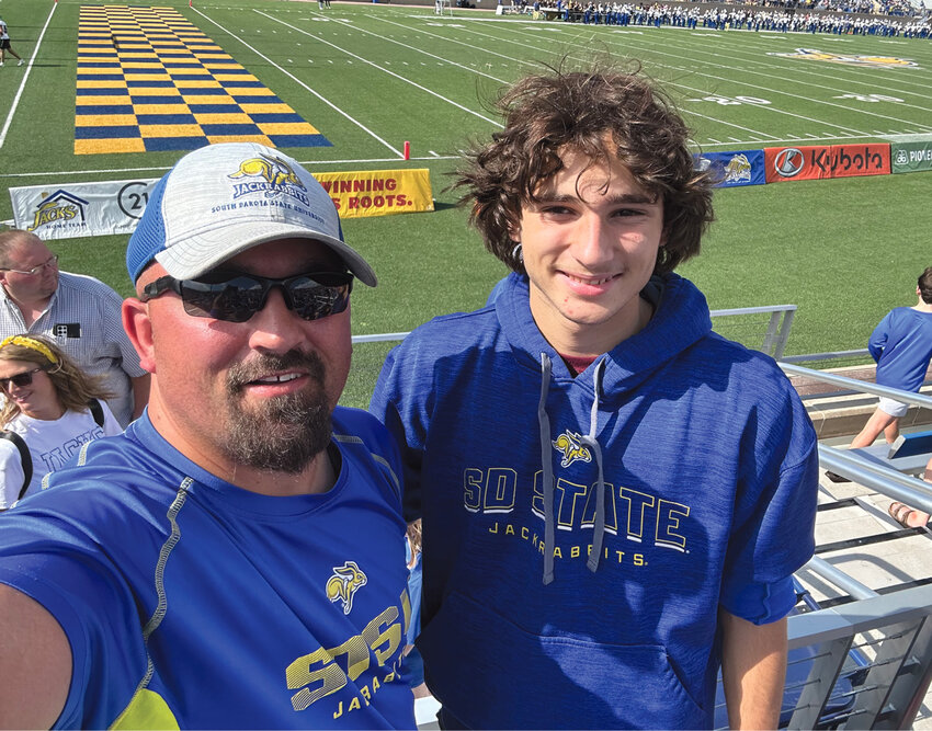 Melville Deloye took in a South Dakota State University football game with his host father Jim Millman.