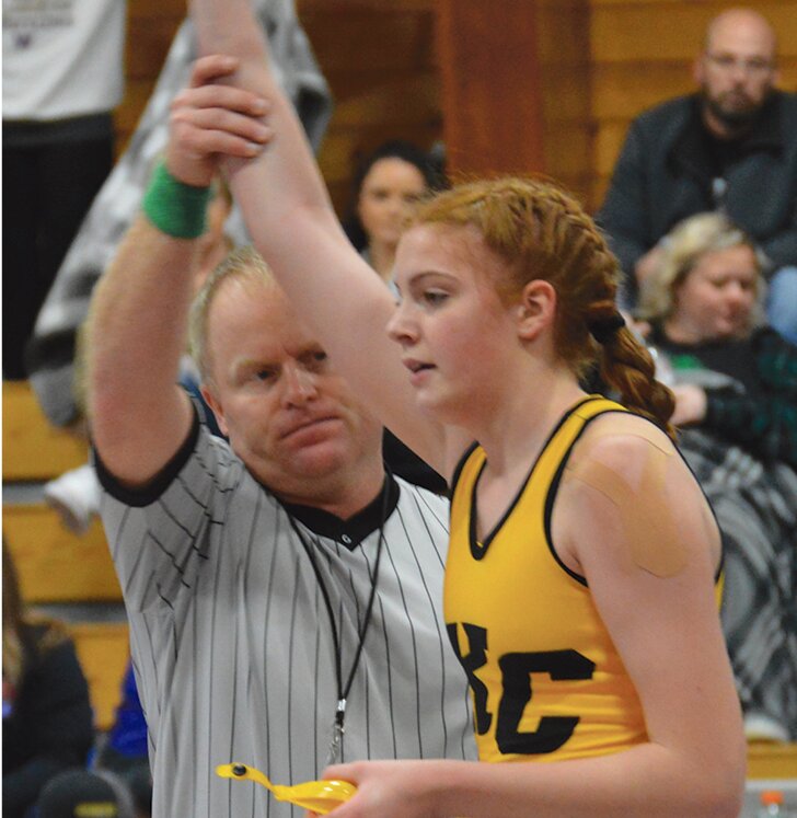 7th grader Jaidynn Giedd gets her hand raised after semi-finals win over St. Thomas More&rsquo;s Teagan Vining