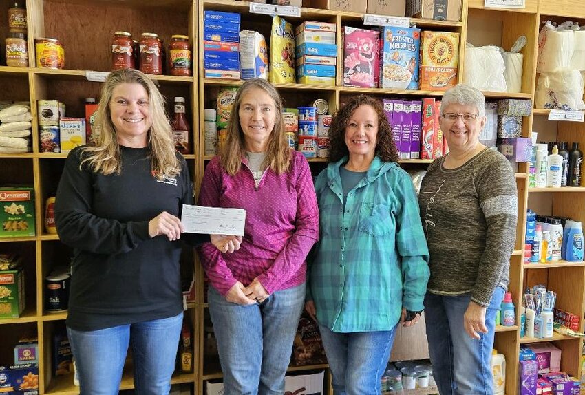 Angie Christiansen from NorthWestern Energy presented the De Smet Food Pantry with a check for $500 on Tues., Jan. 9.  Pictured are Angie Christiansen, left, Lynn Beck, Lorenda Anderson and Glenda Haines