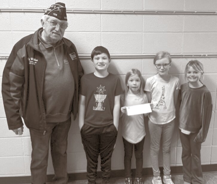 Pictured are Gary Wolkow, Wyatt Peckenpaugh, Elizabeth Griffith, Evelyn VanSchoiack and Blakely Wendling. The third graders raised $318.