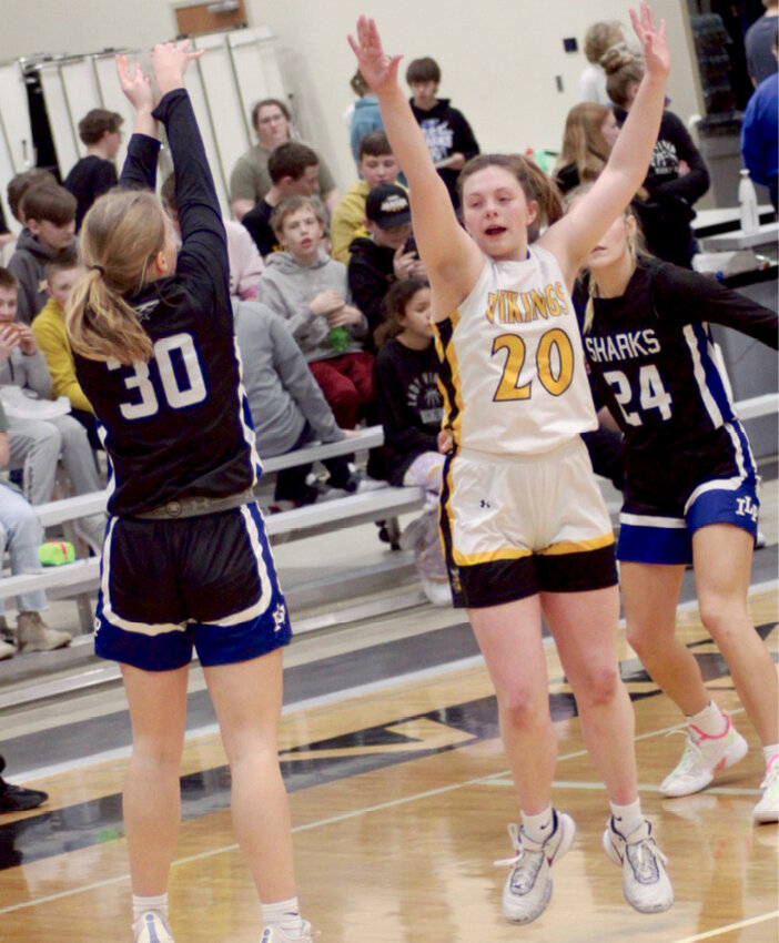 Rebecca Bich attempts a three-point shot against James Valley Christian.