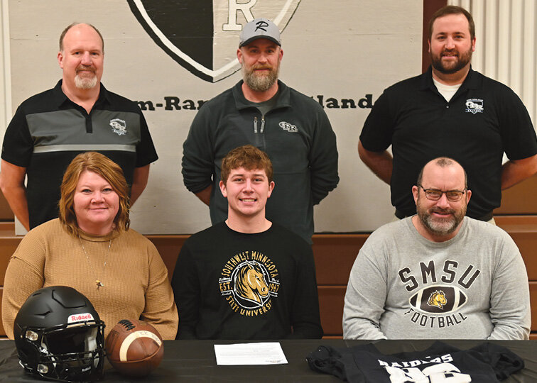 Caden Hojer from Oldham-Ramona-Rutland High School participated in the national signing day on Feb 7. Hojer signed a letter of intent to continue his football career with the Southwest Minnesota State University Mustangs. He is the son of Jay and Michelle Hojer of Oldham. Pictured are Jason Hanson, athletic director, back left; Josh Olson, ORR assistant coach; Logan DeRungs, ORR head coach; Michelle, front left, Caden and Jay Hojer.