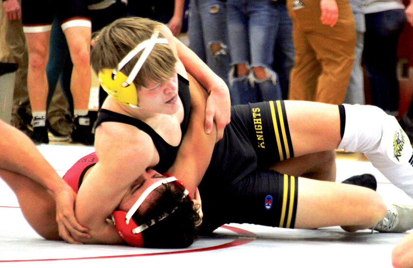 Kaleb Johnson closing in on a pin of Potter County freshman Ayden Forgey at 150.