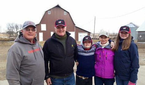 Al Vedvei stops to take a photo with Knut Tore, his son Knut Nicholai, his wife Berit and daughter Ingrid Tonette from Norway who stopped by the ranch to learn more about farming and ranching in America.