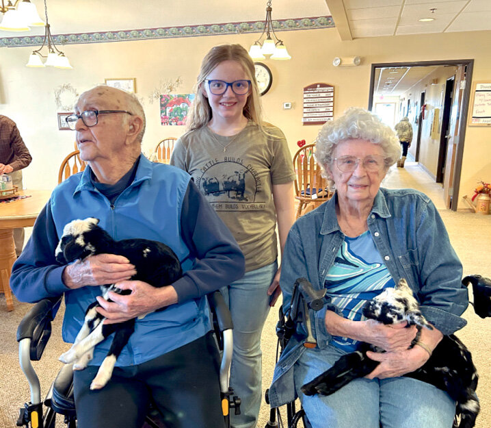 Cork and Illdena Poppen, holding one-day-old Katahdin hair lambs. Rylee Fox brought her lambs to Parkview Assisted Living last week for the residents to enjoy.