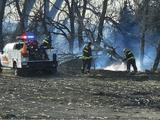 With the near 55 mile-per-hour winds on Saturday, dry conditions and low humidity, our area was in a Fire Weather Watch. Here, the De Smet Fire Department was fighting off a shelter belt that caught fire.