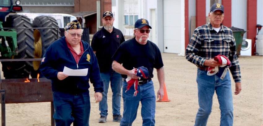 American Legion members from Kingsbury County held their county meeting and meal April 24 at the Legion Hall in De Smet. Following the meeting, members took part in a ceremony to properly dispose of unserviceable flags. Legion members Lyle Richards, left, Dale Thomson and Laird Beck come forward with flags to be inspected by the commander. Bob Blaha, back, played the bugle as part of the ceremony.