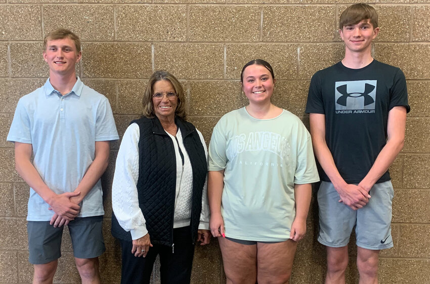 Mary Wilkinson (second from left) was named Booster of the Year at Sunday's athletic awards banquet in De Smet. She is joined by Entringer Scholarship awardees Kadyn Fast (left), Emily Jennings and George Jensen.