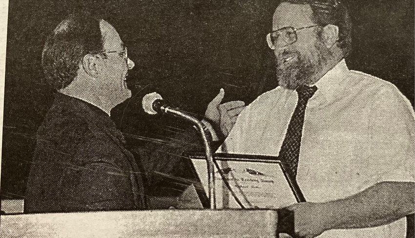 TWENTY-FIVE AGO: Lake Preston High School principal Paul Nelson congratulates math instructor Richard Ritter at Monday&rsquo;s awards program. Ritter received an Excellence in Teaching Award from the South Dakota State University Department of Electrical Engineering. He has taught math at LPHS since 1980.