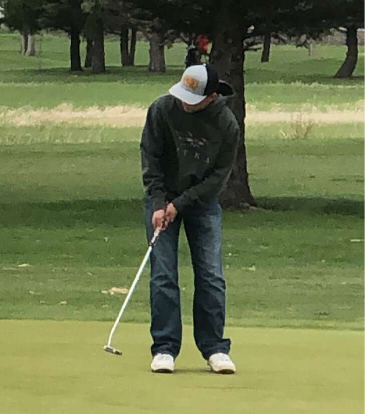 Max Kees putts on the second hole during the DVC Conference Tournament held Mon., May 6 at Sunrise Ridge Golf Course in Colman. Kees finished 10th overall.