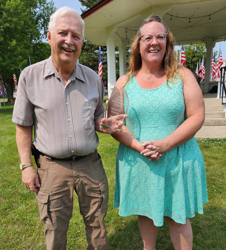 Donna Bumann, Lake Preston Forward President, presents the Community Citizen Award to Merrill Zeeck. Zeeck has given many hours to the community over his years as a resident. He has been involved with the school, the American Legion and Lake Preston Forward, to name a few. He always has a kind word, a smile and a conversation ready to give. This award is given annually at Town &amp; Country Days by Lake Preston Forward.