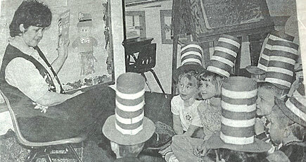 TWENTY-FIVE YEARS AGO: Kindergarten teacher Liz McGuire and her students took time out to read during the Read Across America celebration last week. The observance also celebrates the birthday of Dr. Seuss, so students from K-12 took a reading break on March 2 during third period.