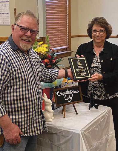 Cindy Bau was recognized Wednesday for 37 years of service as Kingsbury County Emergency Manager and 911 Coordinator. Commission Chairman Kyle Lee presented her with a plaque in appreciation for her service.