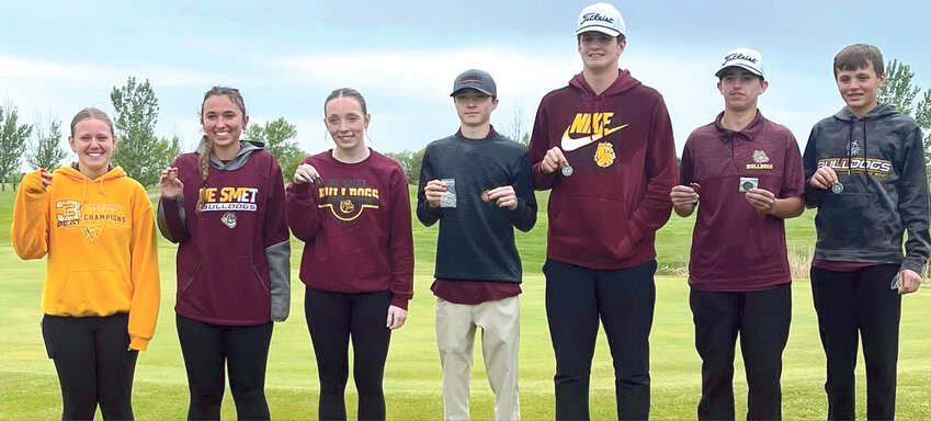 Golfers pose after the region meet: Savannah Larson, left, Brooke Jennings, Harper Anderson, Daniel Sudenga, Carter Wilkinson, Maxxon Kees and Gradyn Henrich.