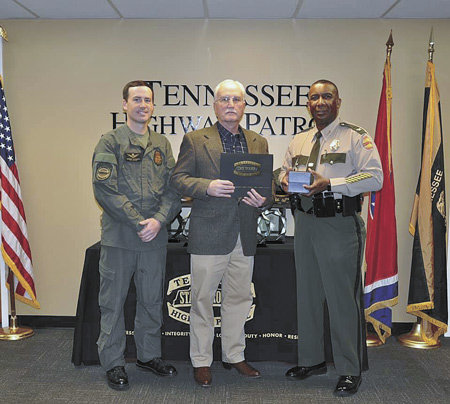 Lieutenant Steve Russell retires from the Tennessee Highway Patrol. He is pictured with his son, Sergeant Lee Russell, Lieutenant Steve Russell in the middle, and Colonel Derek Stewart of the THP.