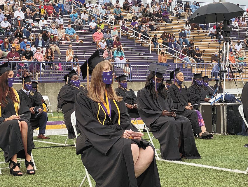 Kensley Horner sits on the front row of the graduates. Candidates for graduation were appropriately spaced and the seating of the audience was limited. The event was streamed live for anyone to watch elsewhere.