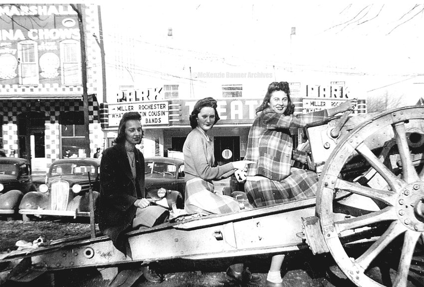 Willie Bell (Bradley) Stubblefield, Mary Francis (Oliver) David, and Elaine Mitchell, about 1944. Gleason girls pose on the cannon in the downtown park. The Park Theatre (in background) was showing &ldquo;What&rsquo;s Buzzin&rsquo; Cousin?&rdquo; starring Ann Miller &amp; Rochester.