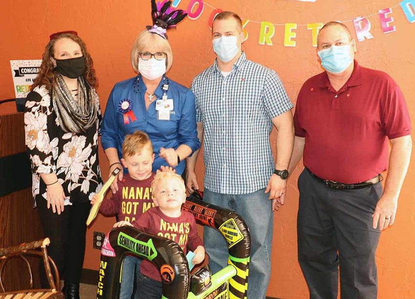Sharron Holland Retirement at Baptist Hospital - (L &mdash; R) Michelle Holland (daughter-in-law), Sharron Holland, Ryan Holland (son), Jerry Holland (husband), and grandsons, Ryan and Patrick.
