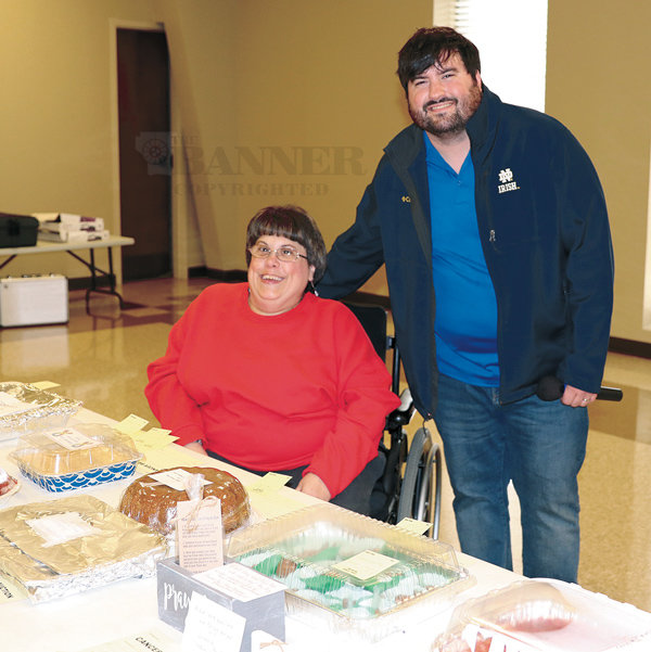 Sherrye Washburn, chairman, and Nathan Powell were two of the volunteers at the annual Carroll County Relay for Life Bake Auction.
