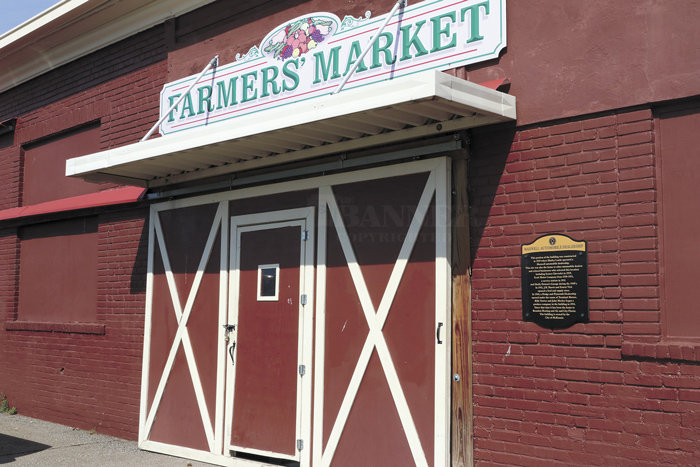 McKenzie Farmers&rsquo; Market opens Saturday for the 2021 season. The historic building, once an automotive dealership, air conditioner business, and florist, is an indoor market. Some vendors set up outside with their products.