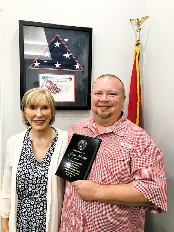 Mayor Jill Holland presents Councilman Jason R. Martin a plaque in recognition of his service with the City of McKenzie.