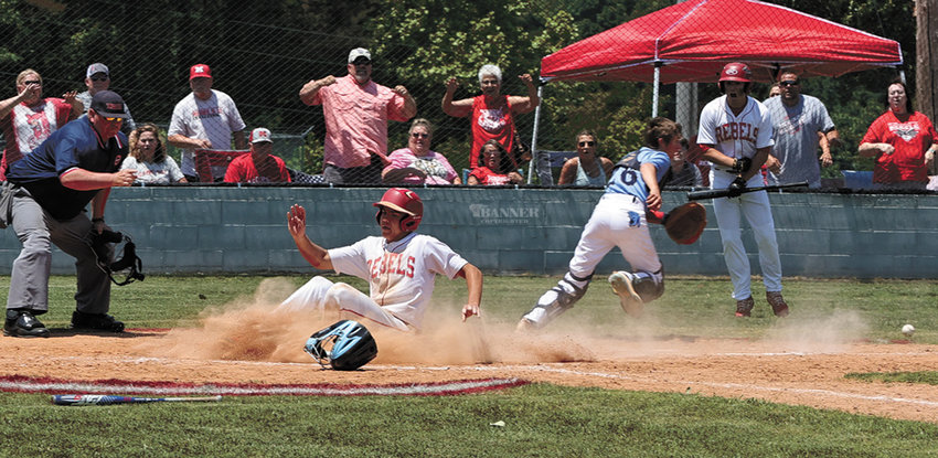 Tate Surber slides home for a score.