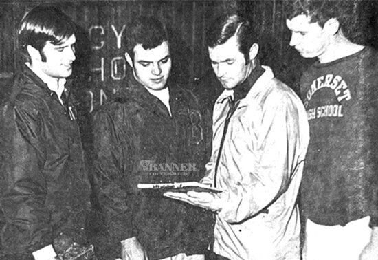 Bethel College Baseball Coach Jerry Wilcoxson and his pitching staff look over the 1970 baseball schedule. Pictured (L to R): Bruce Haver, Gary Harris, Coach Wilcoxson and Bruce Herrin.