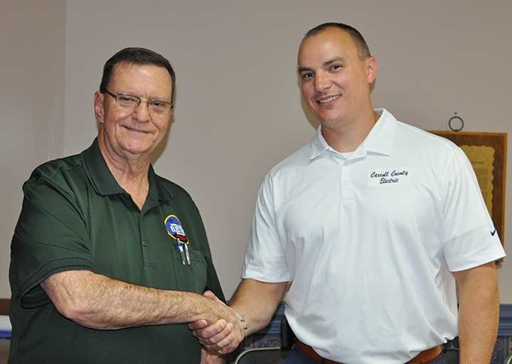 Carroll County Electric Department General Manager (left) congratulates Ryan Drewry on his selection as incoming general manager.