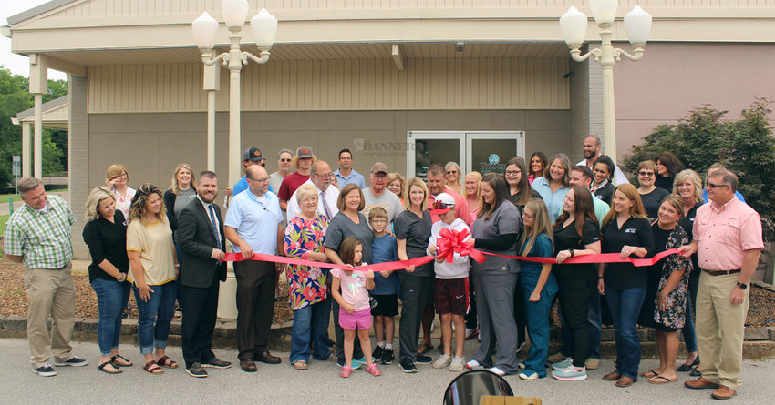 Co-owner Heather Garrett&rsquo;s son, Hudson, cut the celebratory ribbon surrounded by friends, business people, government officials, and Tri Star Family Health Care staff.