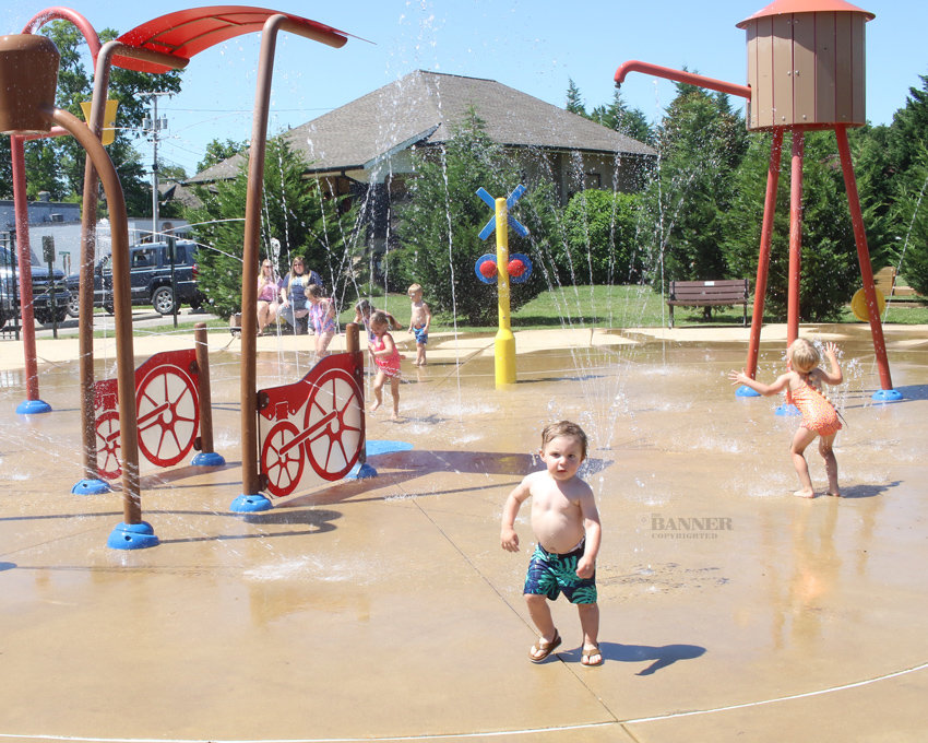 Children cool off at McKenzie Station Splash Pad on Monday afternoon.
