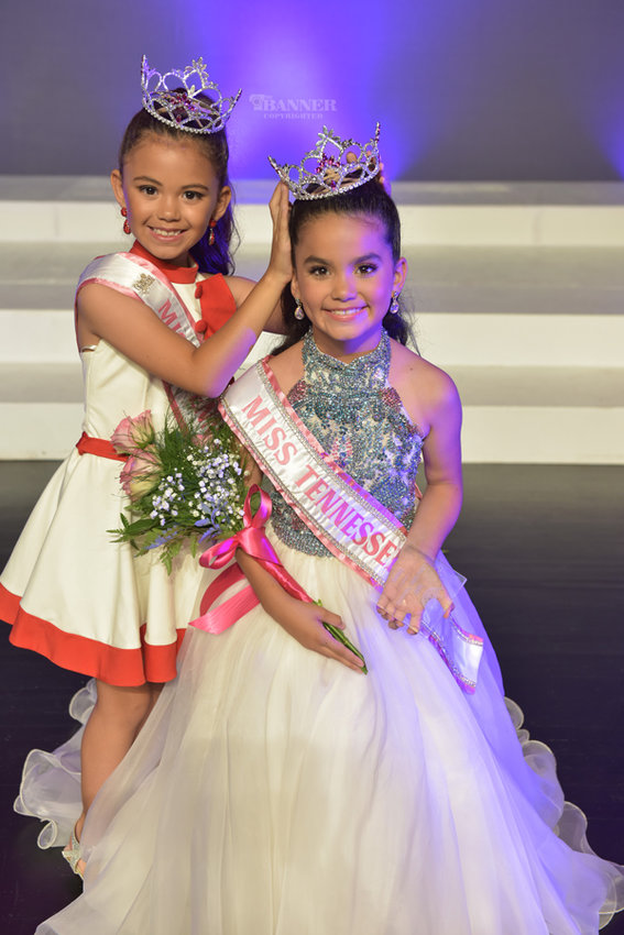 Lola Faye Batton (8) crowned by her sister Bella Kate Batton (10) at the Miss Tennessee Volunteer Pageant on Sunday, June 12. Photo by Darren Lykes