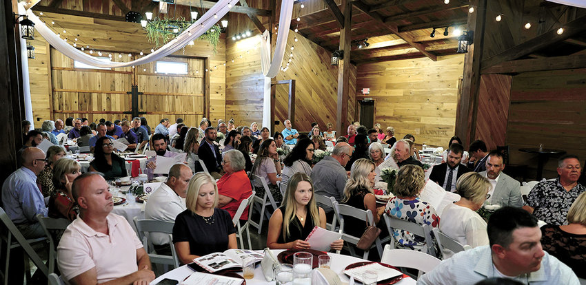 Attendees enjoyed a catered meal. The event was held at the The Venue at Waddell Place.