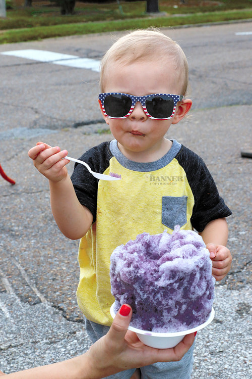 Two-year-old Shepard Clifft enjoys a snow cone from Rollin&rsquo; Snow.