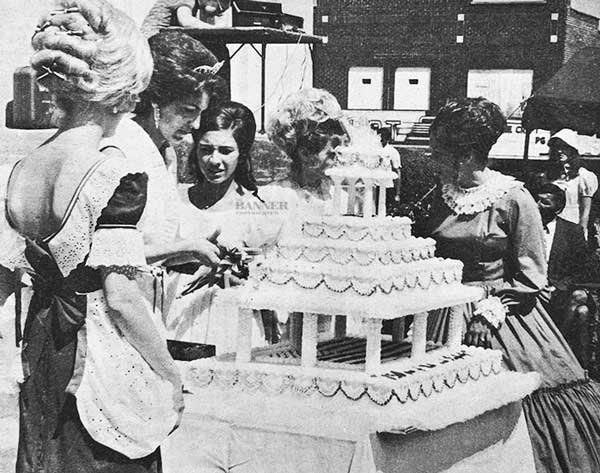 Sesquicentennial queen and royalty shown cutting cake (L to R): Jennifer McClelland of McKenzie, Jane Bannister of Bruceton, Linda Lewis of Huntingdon, Pat Belew of Trezevant and Judy Berryhill of McKenzie.