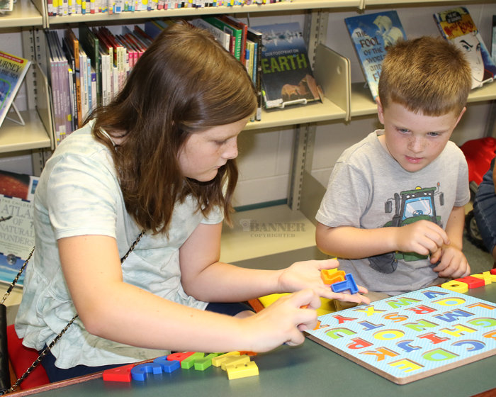 Kathryn and Jake Johnson enjoy the games at the Carroll County Library.