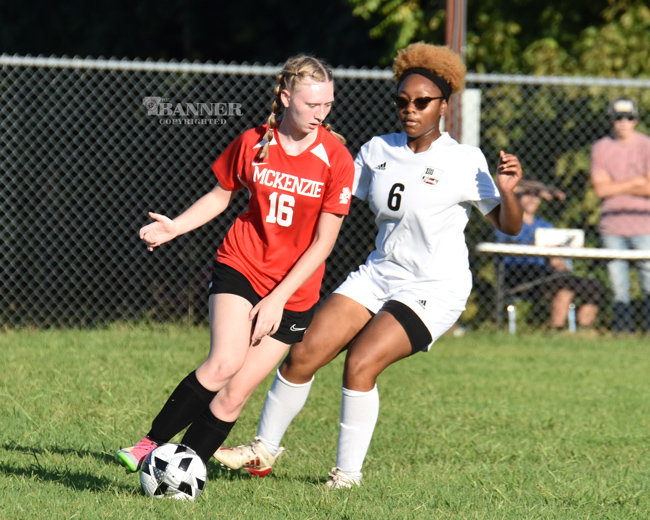 Hannah Lee works the ball away from a Southside defender.