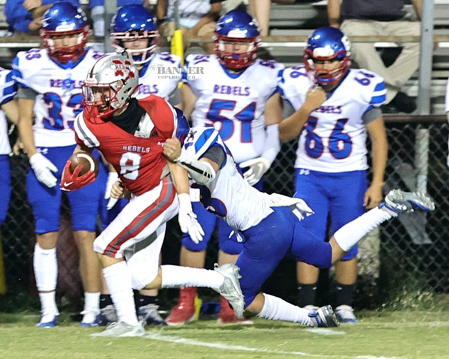 Brady Brewer rushes for yardage against the Obion County Rebels.