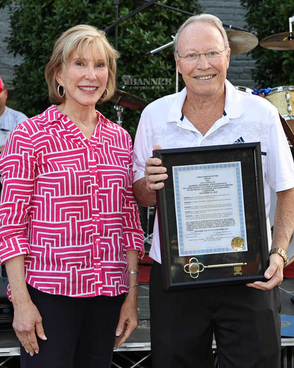 Mayor Jill Holland presents Dr. James (Jimmy) Padgett with a proclamation and key to the city.