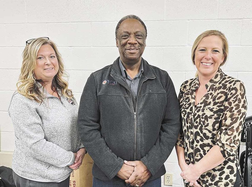 Kristy Meggs, director; Willie Huffman, chairman of the board, and Amanda Pate, new administrative assistant at the 911 administrative office.