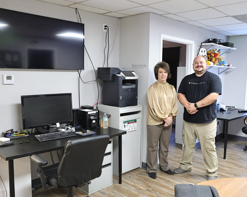 Monica Heath, executive director of the McKenzie Industrial Board, and Jonathan Gaskins, paramedic with Baptist Ambulance Service, inside the totally renovated ambulance headquarters in McKenzie. The Industrial Board owns the building and recently expanded and renovated the facility.