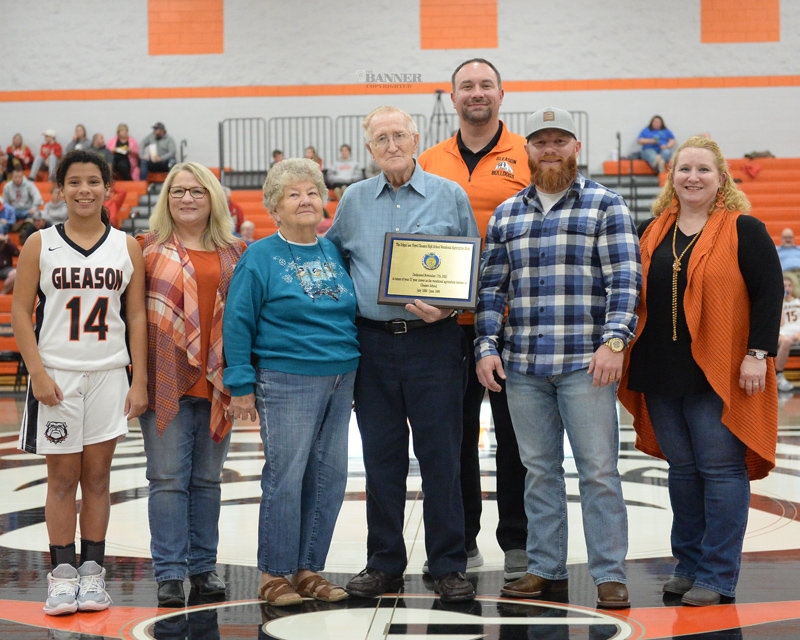 Lee Lawrence, principal at Gleason Schools, presented a plaque honoring Edgar Floyd for a 37-year teaching career. The Agriculture Shop at the school is now named in Floyd&rsquo;s honor.  Floyd&rsquo;s family joined in the celebration.