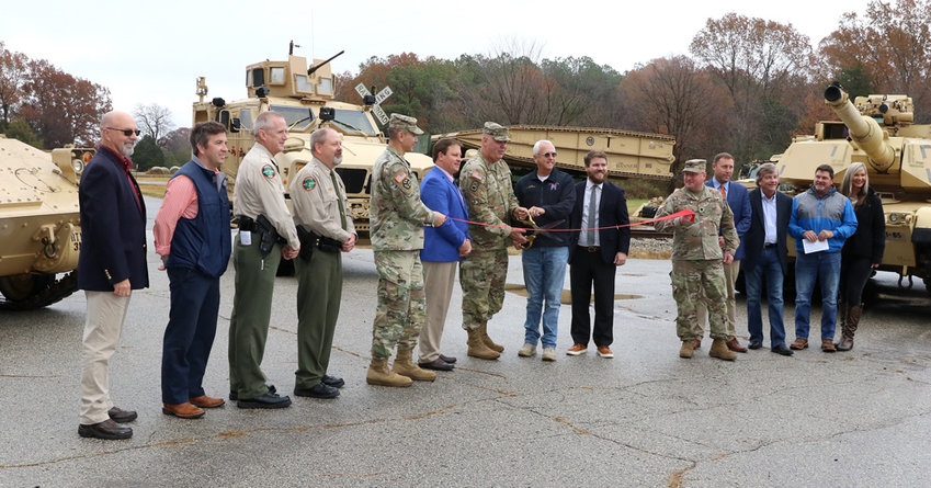 Gibson County Mayor Nelson Cunningham, Brig. Gen. Warner Ross, Tennessee&rsquo;s Assistant Adjutant General-Army, Milan Mayor B.W. Beasley, State Representative Brock Martin and Carroll County Mayor Joseph Butler cut a ceremonial ribbon at the Milan Volunteer Training Site during a ceremony in Milan on December 6.