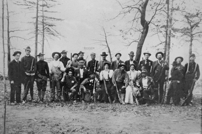 The Lake County posse at Camp Nemo. Judge Harris, owner of Reelfoot Lake, is seated in the front row between his sisters.