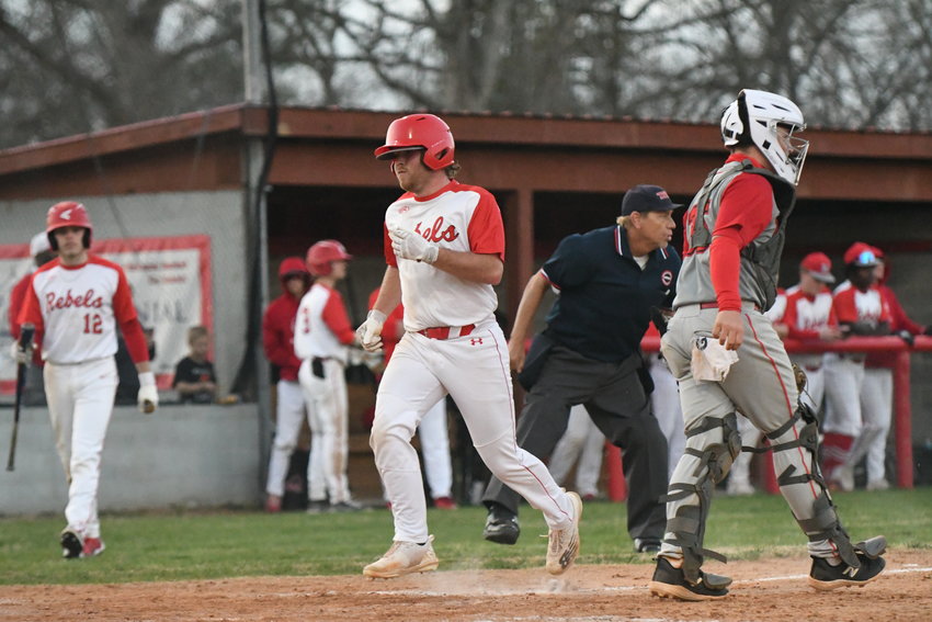 Ty Anderson crosses home plate. Photo by Erin Douglas/The Banner.