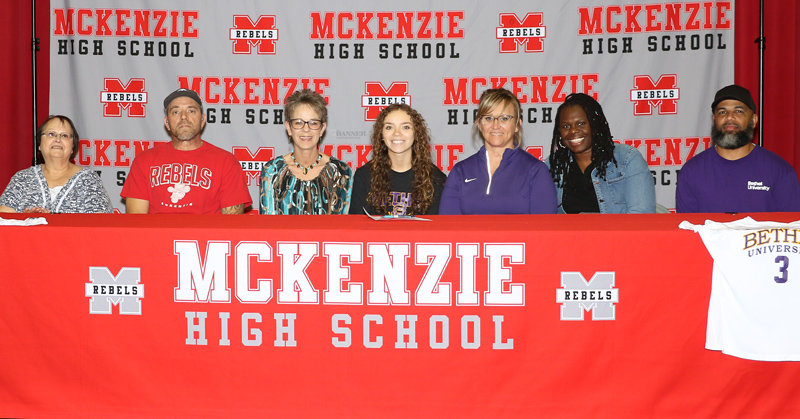 Hannah Dillingham to play soccer for Bethel Lady Wildcats. (L to R) Frances Allen, Phillip and Suzanne Dillingham, Hannah Dillingham, B.U. Coach Misty Aird, MHS Coach Karlene Brown and MHS Assistant Jeremy Bilger.