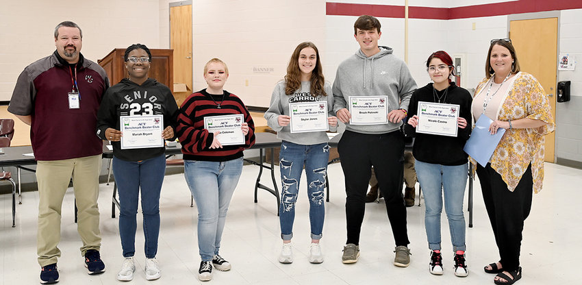 HIGH SCORING SENIORS &mdash; West Carroll Jr./Sr. High Principal Joe Tetleton and Counselor Piper Jenkins recognized several seniors for benchmark achievements on their ACT tests during Thursday night&rsquo;s West Carroll School Board Meeting. Pictured are (L to R) Joe Tetleton, Mariah Bryant, Zeta Coleman, Skylar Jones, Brock Polinski, Nicole Castro and Piper Jenkins.