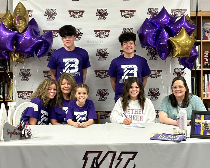 Sydney Bosley, a senior at West Carroll High School, commits to cheer at Bethel University.  Sydney is pictured with her sisters, Samaria and Stormie, brothers, Preston and Parker, her mother, Michelle and WCHS cheer coach Keshia Jackson.