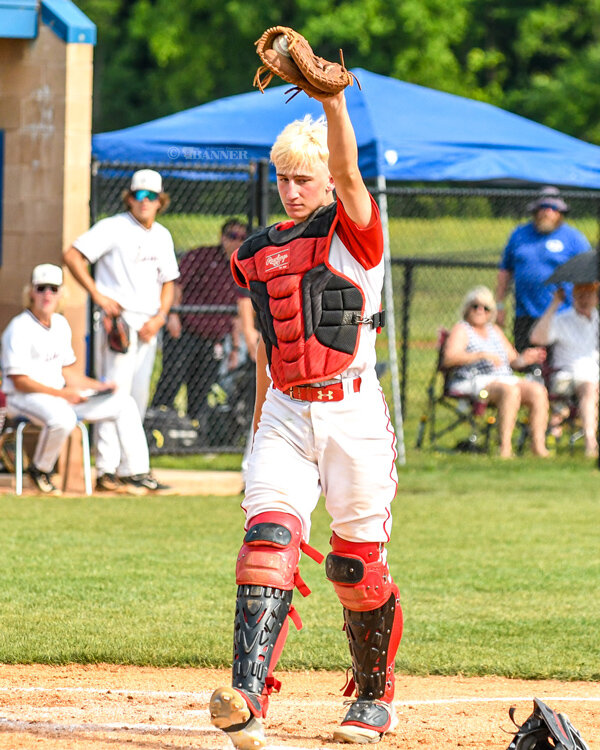 Jake Cassidy raises up his glove after making a tag at the plate during game two of the doubleheader.