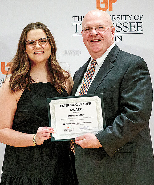 Dr. Andy Lewter, UT Martin vice chancellor of student affairs, presented Samantha Roney with the Emerging Leader Award at the annual Greek Awards ceremony.