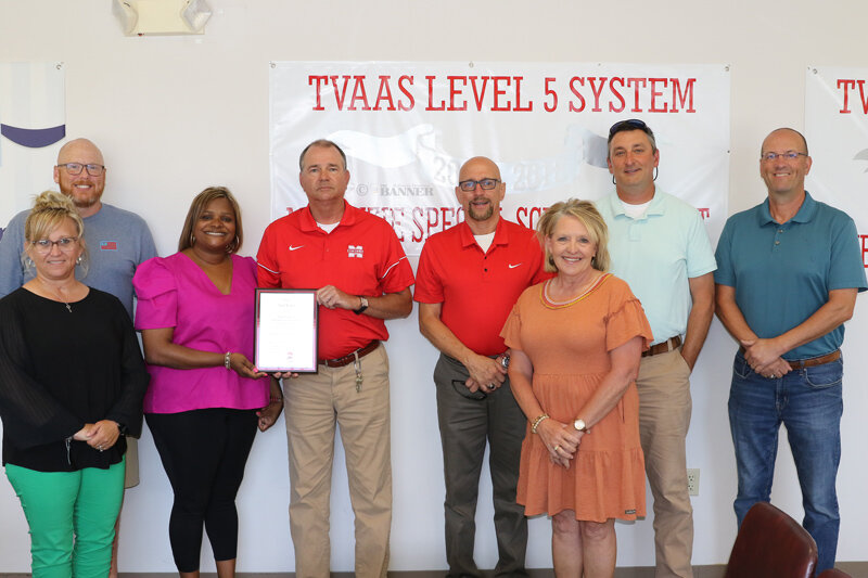 Lynn Watkins was honored by members of the McKenzie Board of Education. (L to R) Misty Aird (front), Chad Brown, LaShonda Williams, Lynn Watkins, Bobby Young, Karen Fowler (front), George Cassidy and Spiros Roditis.